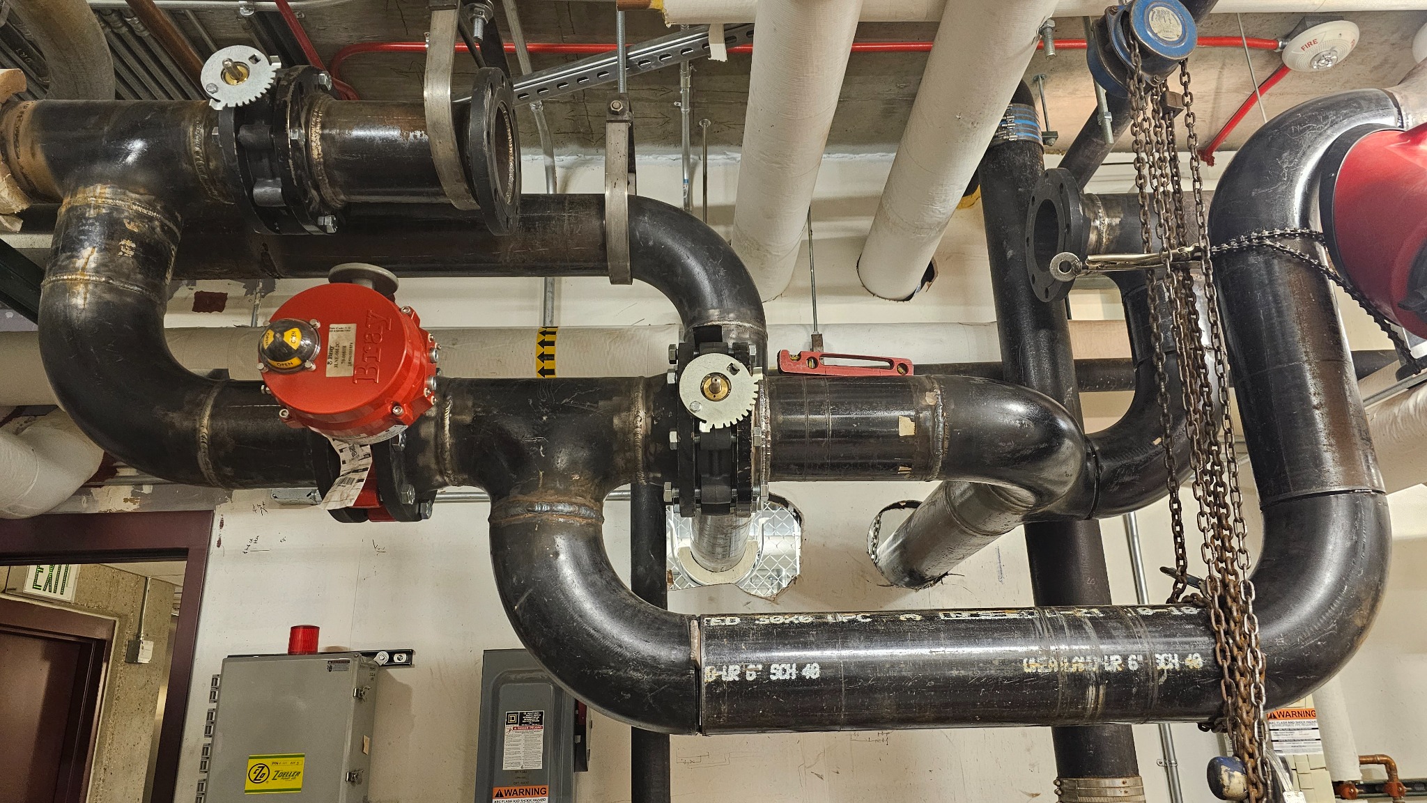 Mechanical room piping with valves and equipment connections