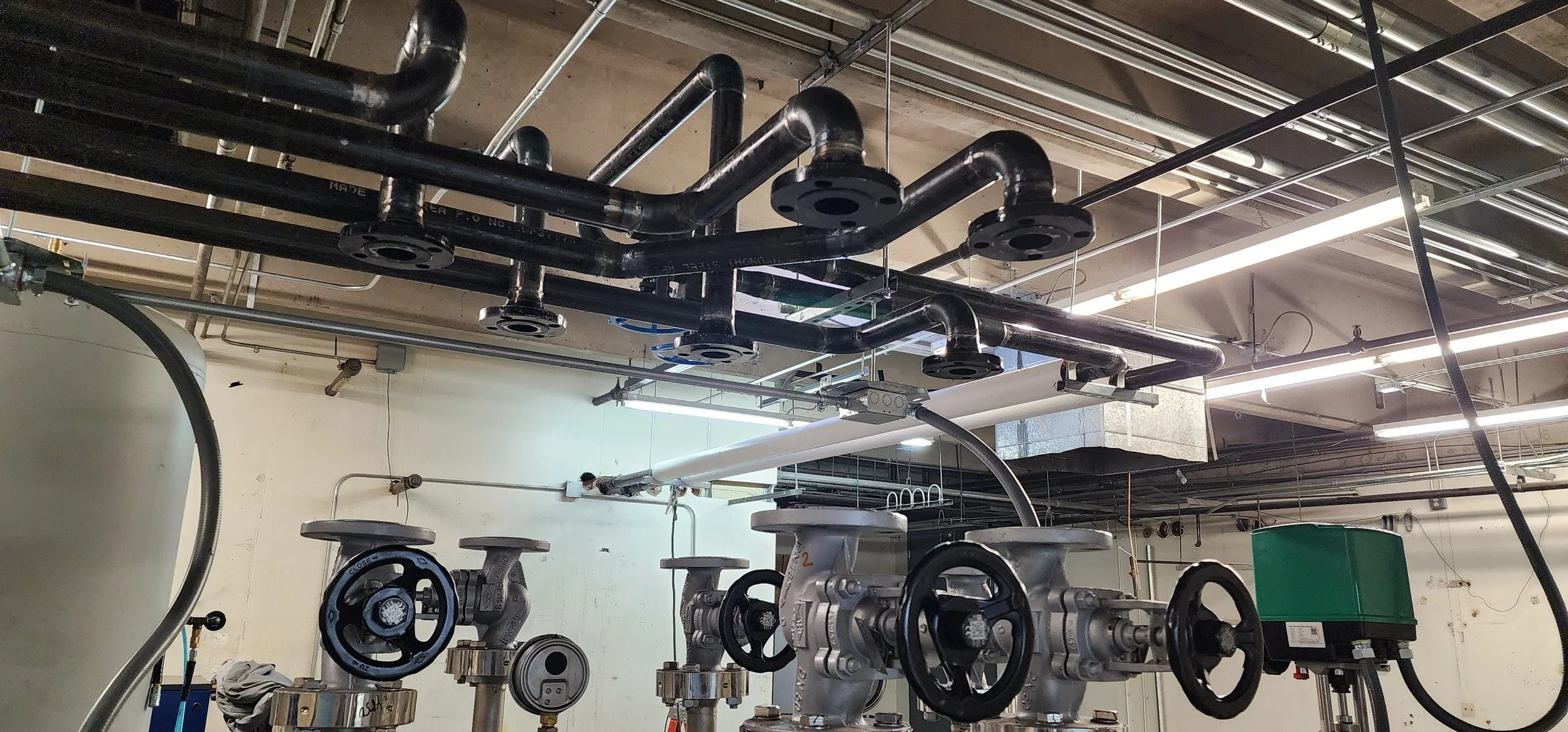 Overhead black steel process piping system